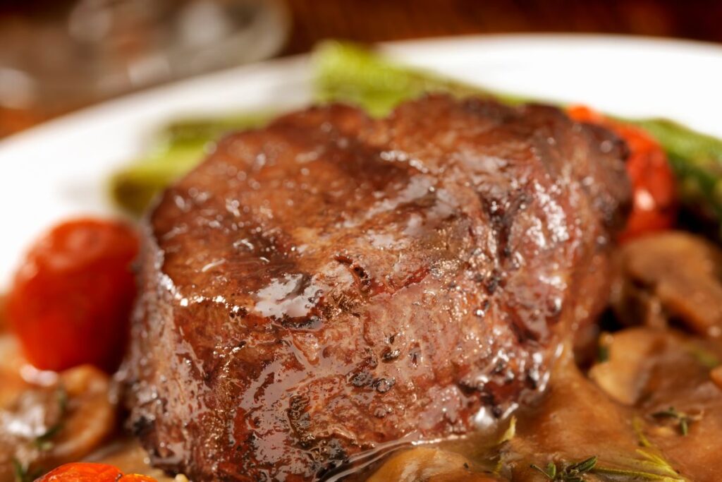 Chuck tenderloin steak raw on cutting board