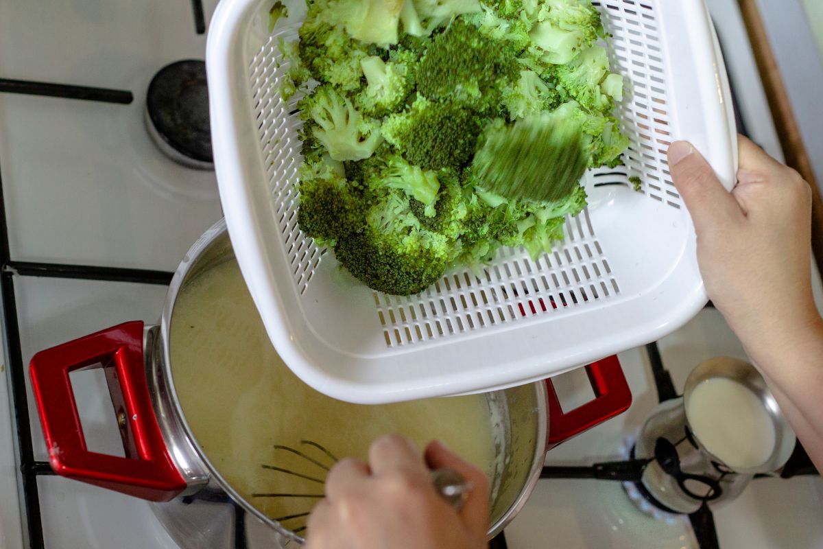 Freshly grated cheese and broccoli florets, key ingredients for gluten-free broccoli cheddar soup."