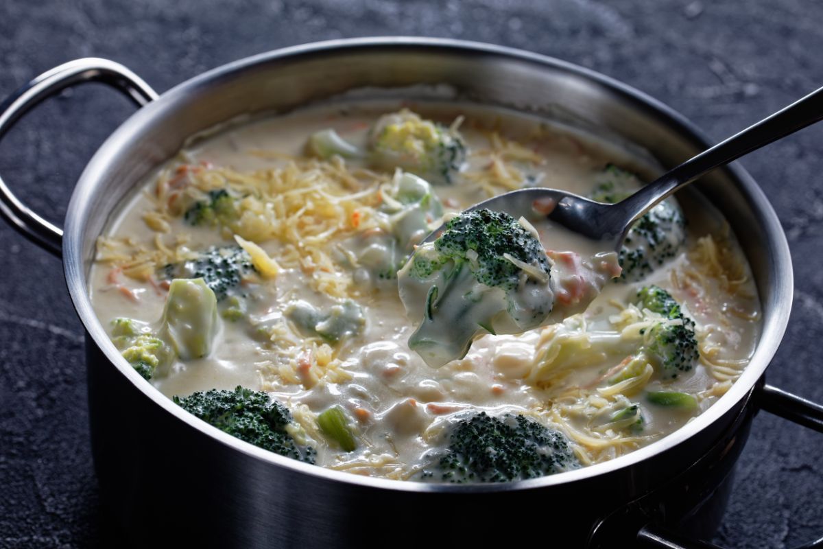 Grilled chicken breast and roasted vegetables paired with broccoli cheddar soup