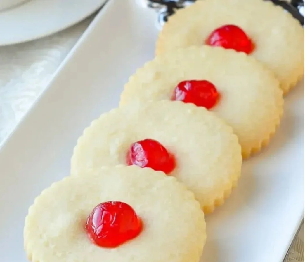 A plate of old-fashioned shortbread cookies, golden and crumbly.