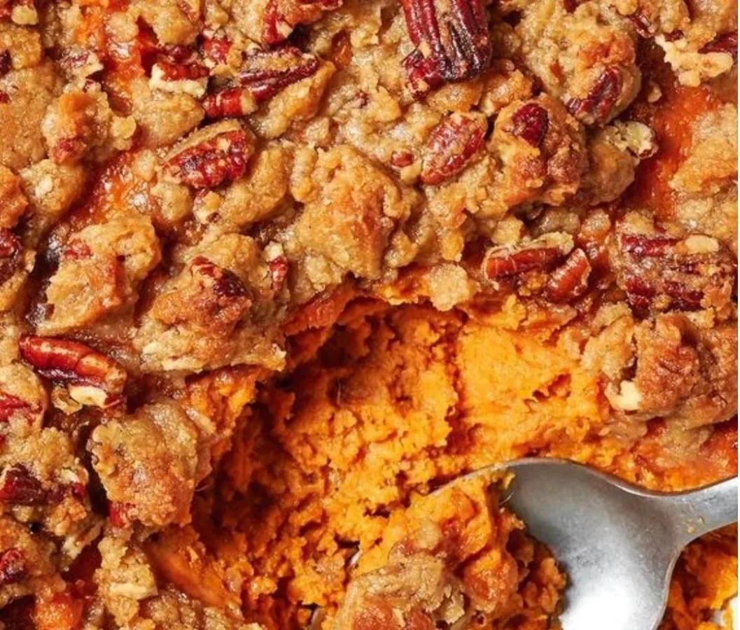 Delicious sweet potato casserole topped with marshmallows and pecans