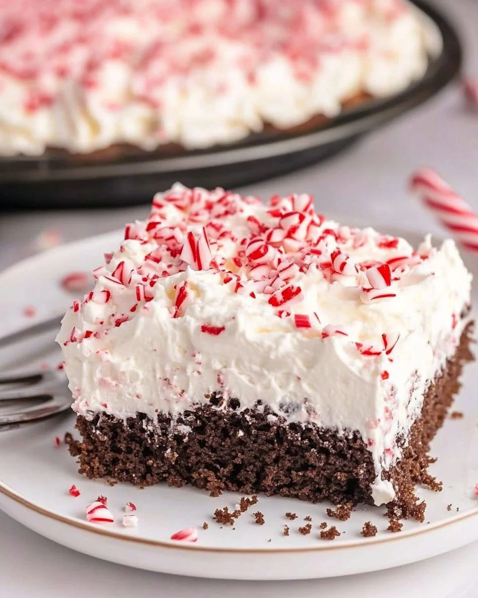 Delicious chocolate peppermint poke cake with festive toppings