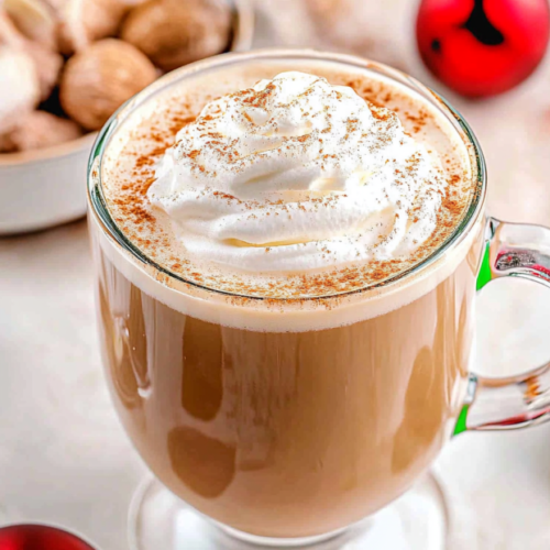 Cozy eggnog latte topped with whipped cream and nutmeg