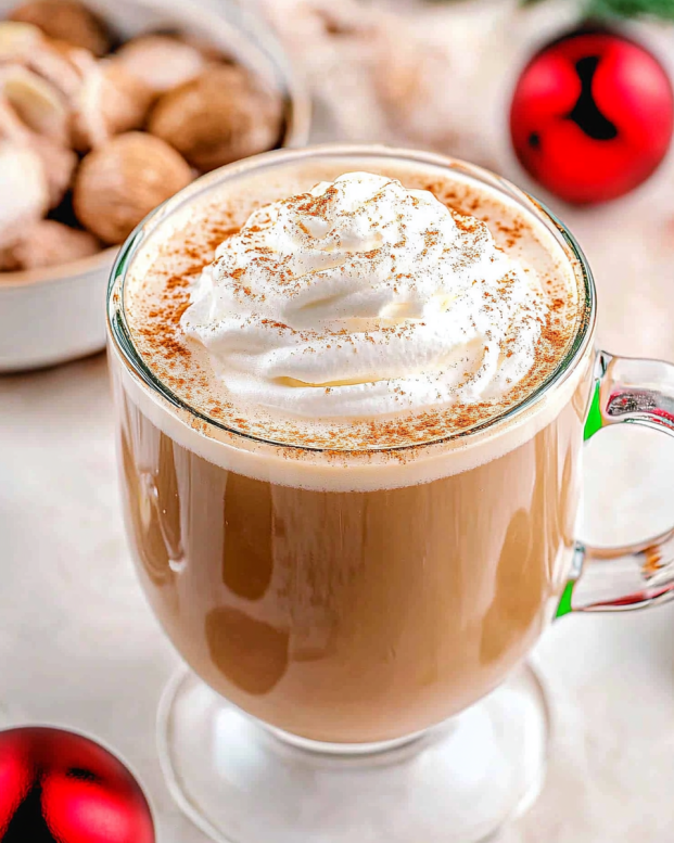 Cozy eggnog latte topped with whipped cream and nutmeg
