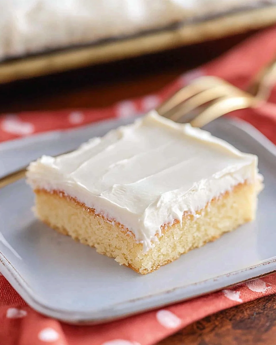Delicious white sheet cake served on a decorative platter